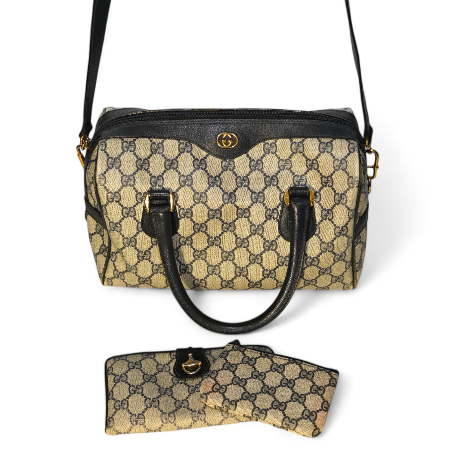 A Gucci monogram blue canvas handbag, wallet and purse